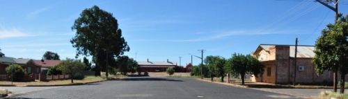Photo of the wide street and old buildings leading up to the heritage Cobar railway station